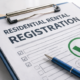 Clipboard with residential rental registration form marked compliant, representing Lucas County rental property registration requirements.