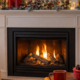 Cozy living room with a lit gas fireplace and winter mantel decor, creating a warm and safe indoor atmosphere during a Toledo winter.
