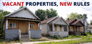 Vacant residential homes in a Toledo neighborhood boarded up and awaiting compliance under new city registration rules