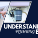 Hero graphic that features a navy blue background with angled photos of a toilet shut-off valve being turned, a kitchen garbage disposal beneath a sink, and plumbing supply lines with a shut-off valve. Large white text reads "Understanding Plumbing Basics."