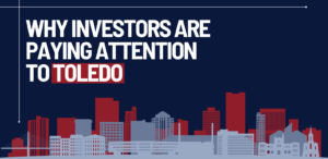 Graphic featuring the title "Why Investors Are Paying Attention to Toledo" and an illustrated Downtown Toledo skyline in red, navy, and gray.