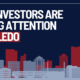 Graphic featuring the title "Why Investors Are Paying Attention to Toledo" and an illustrated Downtown Toledo skyline in red, navy, and gray.