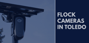Flock license plate reader camera with text reading “Flock Cameras in Toledo.”